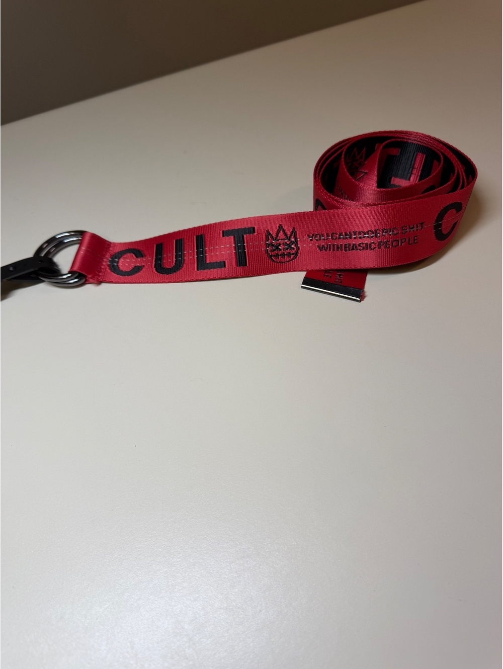 Red Cult Branded Belt with Black Text and Metal Ring